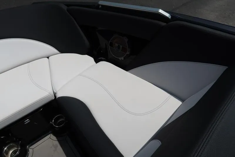 Slide: The Image of 2019 MasterCraft XT22 boat interior with white and black seating, showcasing modern design. - 33