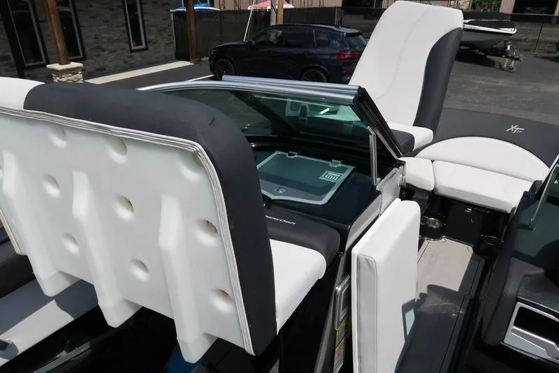 Slide: The Image of 2019 MasterCraft XT22 boat interior with sleek dashboard and steering wheel design. - 34