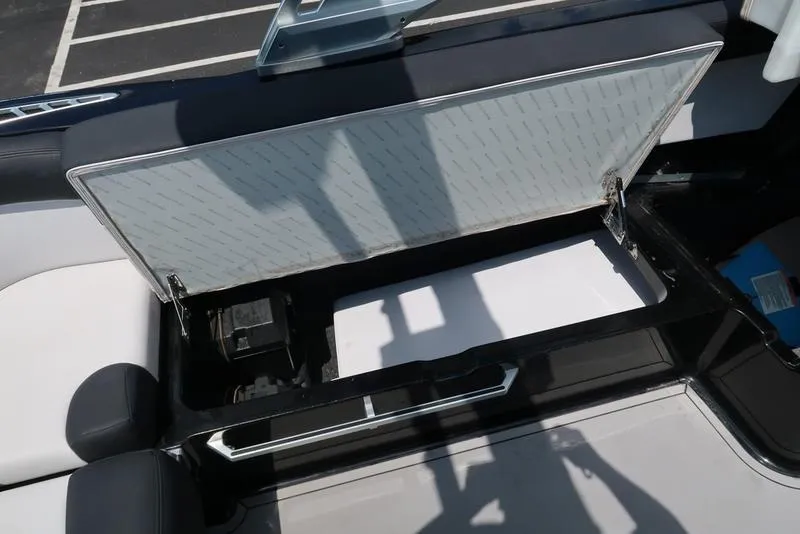 Slide: The Image of 2019 MasterCraft XT22 interior with surfboard and storage compartment. - 36