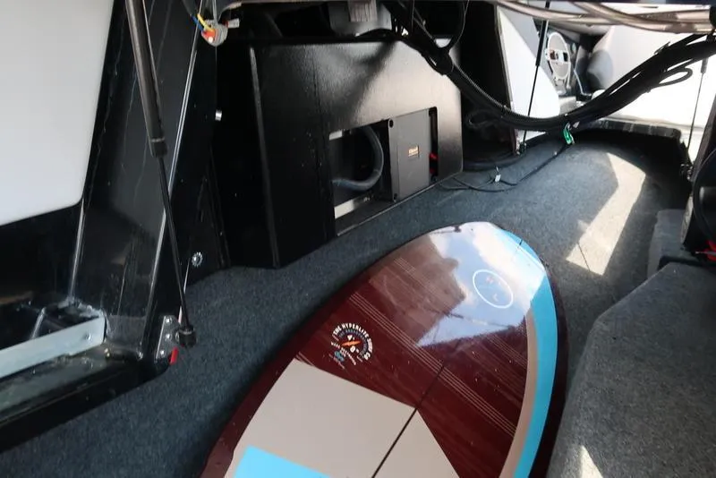 Slide: The Image of 2019 MasterCraft XT22 dashboard with speaker and cup holders. - 37