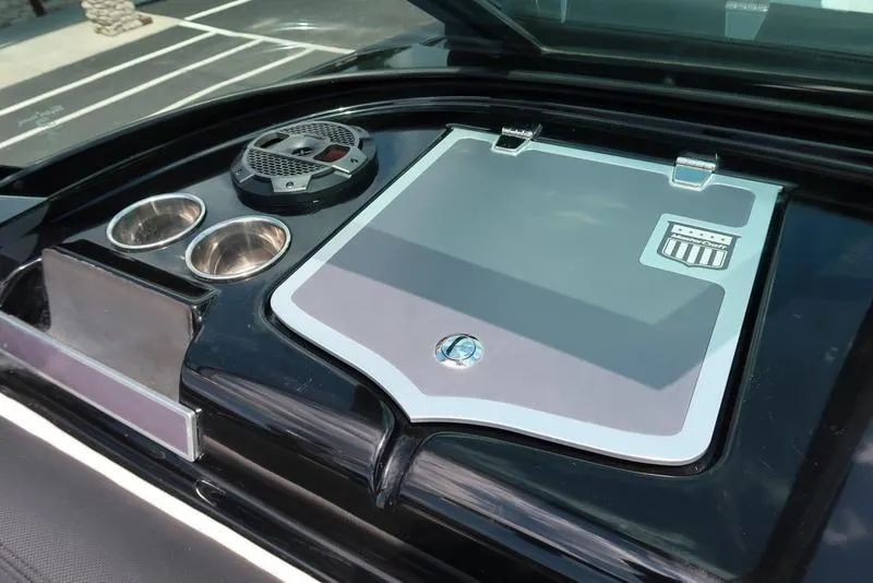 Slide: The Image of 2019 MasterCraft XT22 boat interior with white and black seating. - 38