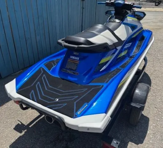 Slide: The Image of 2019 Yamaha WaveRunner GP1800R jet ski on trailer, blue and black design. - 5