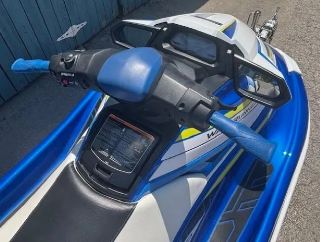 Slide: The Image of 2019 Yamaha WaveRunner GP1800R jet ski with blue and white design, handlebars, and dashboard. - 7