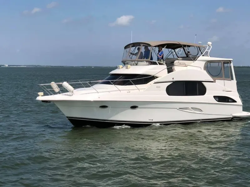 The Image of 2002 Silverton 43 Motor Yacht cruising on open water. - 0