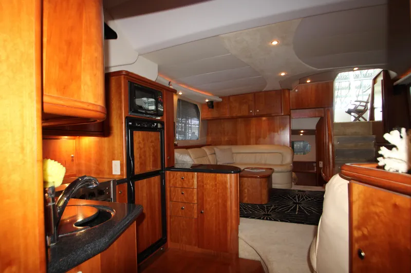 Slide: The Image of Luxurious interior of 2002 Silverton 43 Motor Yacht with wood finishes and modern amenities. - 13