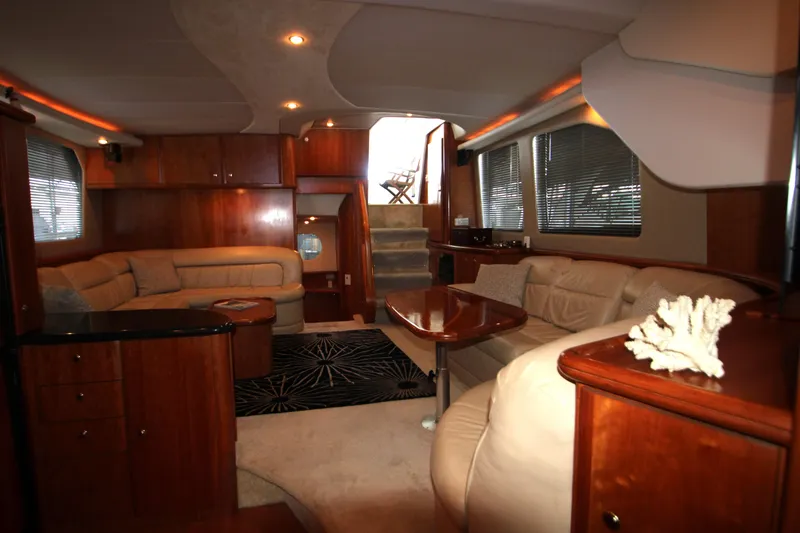 Slide: The Image of Luxurious interior of 2002 Silverton 43 Motor Yacht with elegant wood finishes and plush seating. - 14