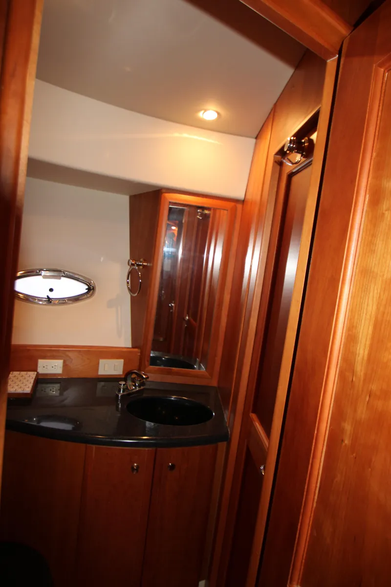 Slide: The Image of Luxurious bathroom in 2002 Silverton 43 Motor Yacht with wood cabinetry and modern fixtures. - 21