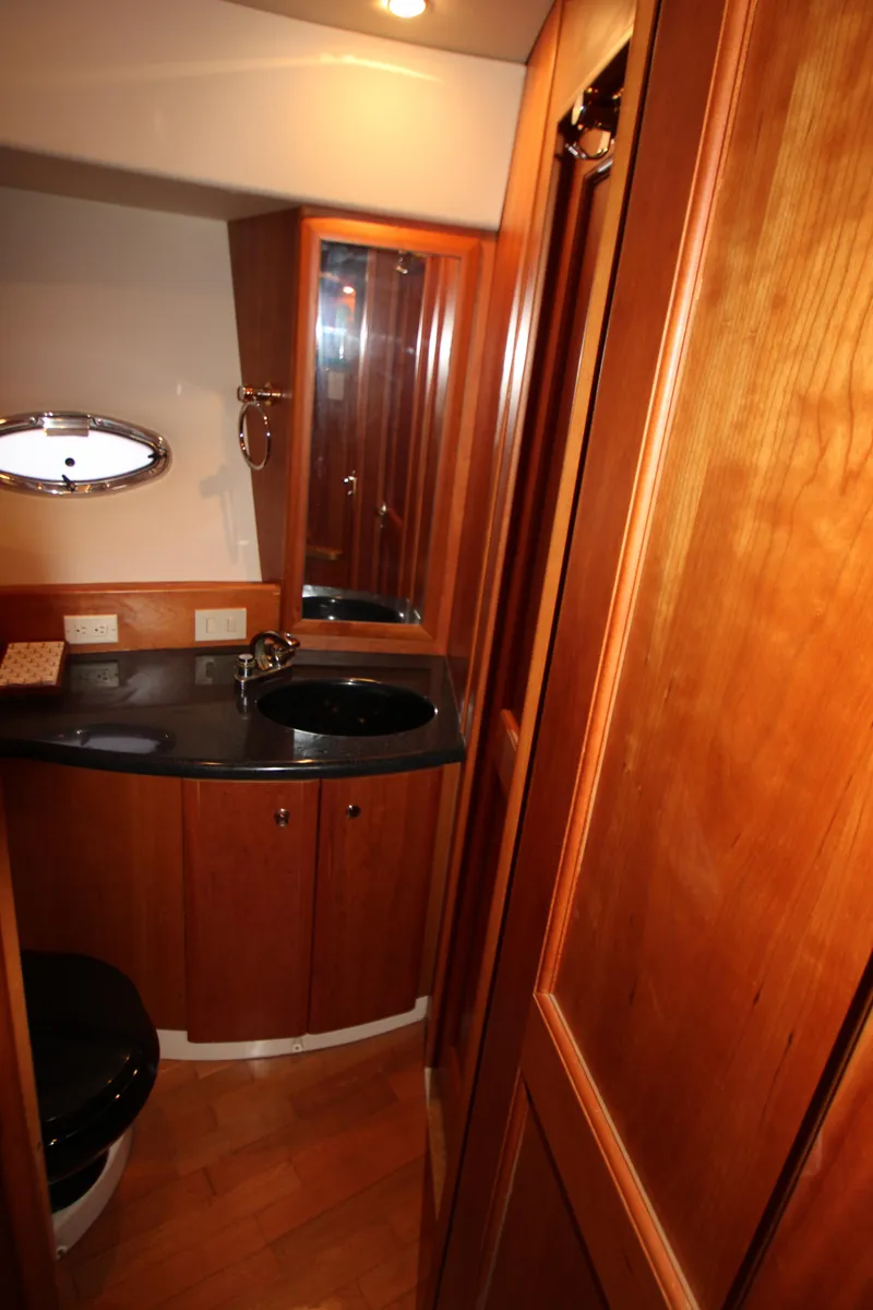 Slide: The Image of Luxurious bathroom in 2002 Silverton 43 Motor Yacht with wood cabinetry and modern fixtures. - 22