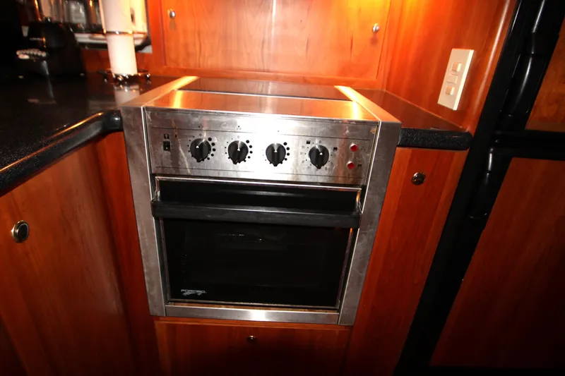 Slide: The Image of Stainless steel oven in 2002 Silverton 43 Motor Yacht kitchen. - 28
