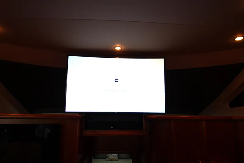 Slide: The Image of Interior of 2002 Silverton 43 Motor Yacht with illuminated TV screen. - 31