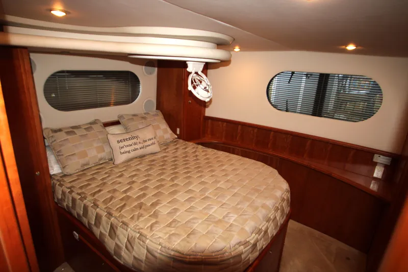 Slide: The Image of Luxurious bedroom interior of 2002 Silverton 43 Motor Yacht with elegant wood finish. - 34
