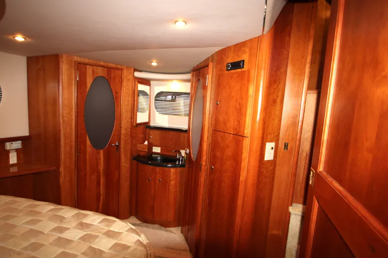 Slide: The Image of Luxurious interior of 2002 Silverton 43 Motor Yacht with wood paneling and modern amenities. - 37