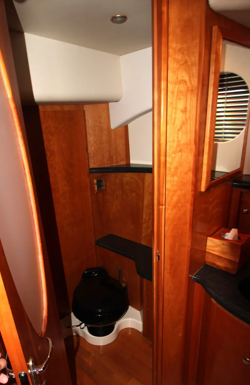 Slide: The Image of Interior of 2002 Silverton 43 Motor Yacht bathroom with wooden cabinetry. - 40