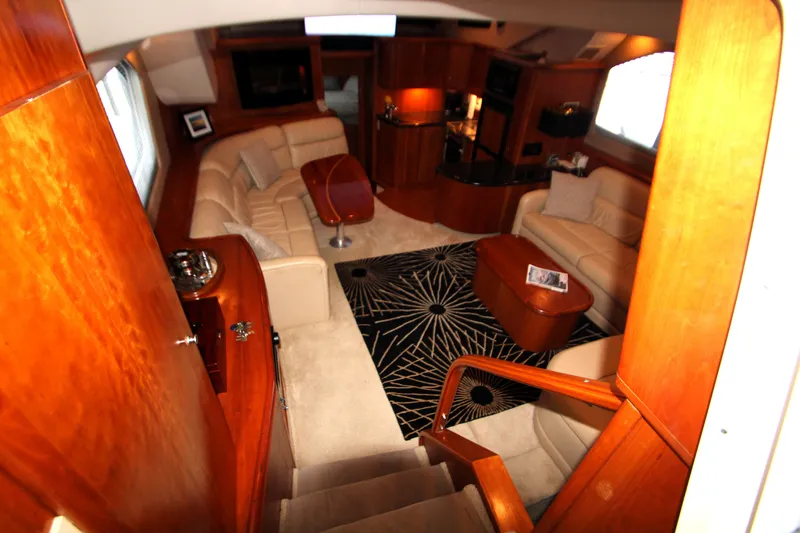 Slide: The Image of Luxurious interior of 2002 Silverton 43 Motor Yacht with elegant seating and modern decor. - 5