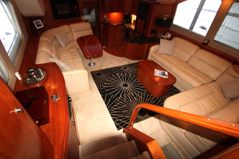 Slide: The Image of Luxurious interior of 2002 Silverton 43 Motor Yacht with plush seating and elegant decor. - 6