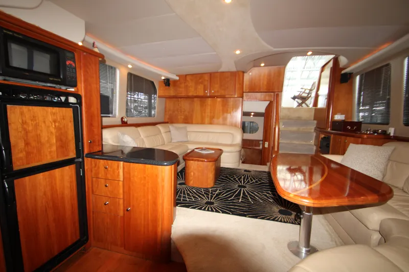 Slide: The Image of Interior of 2002 Silverton 43 Motor Yacht with wood finishes and modern amenities. - 9