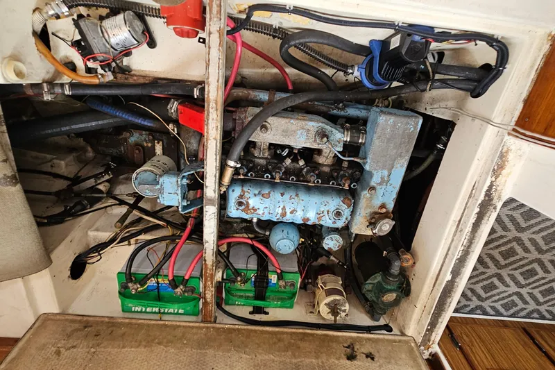 Slide: The Image of Engine compartment of a 1977 Seafarer 38 sailboat, showing wiring and components. - 28