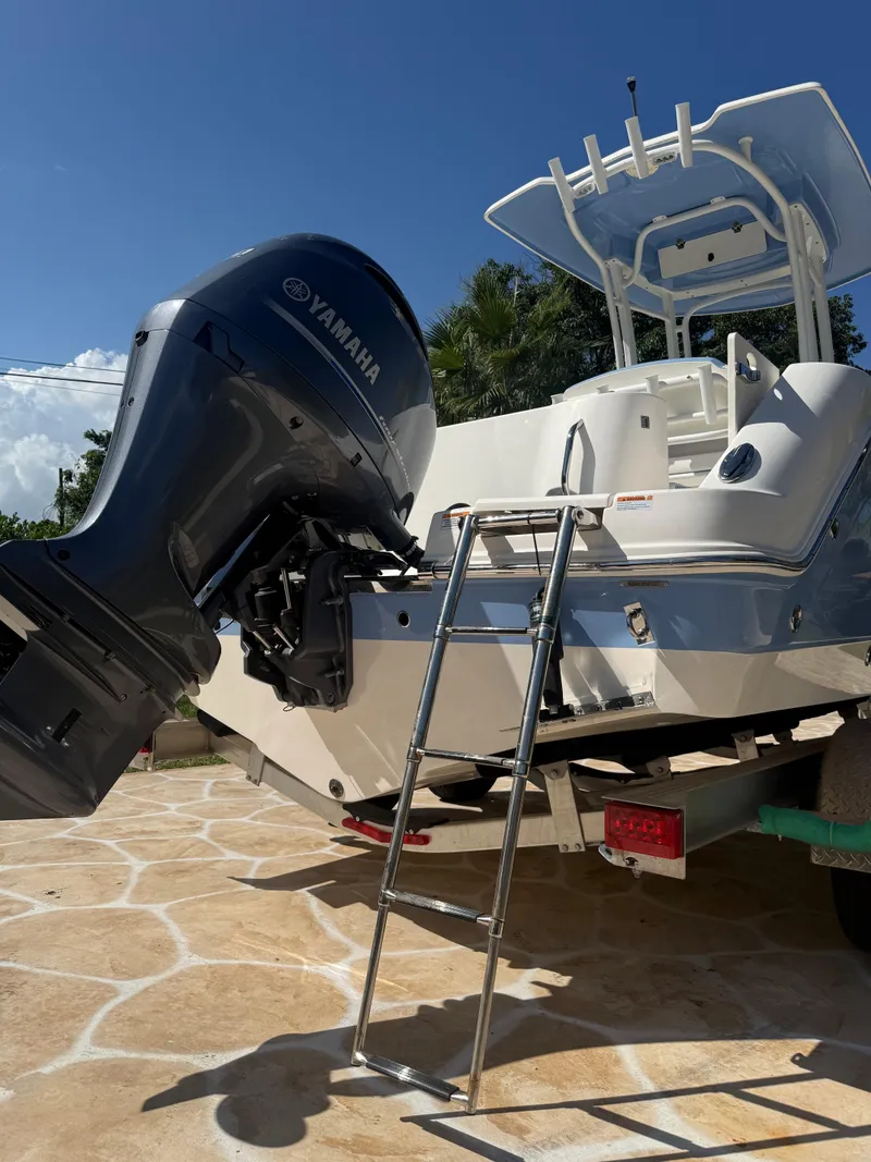 Slide: The Image of 2023 Robalo R222 boat with Yamaha engine and ladder on trailer. - 16