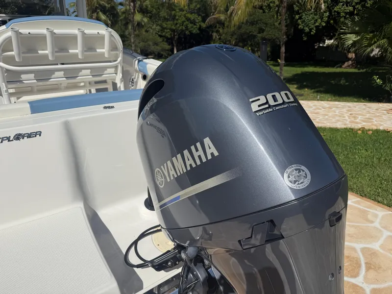 Slide: The Image of 2023 Robalo R222 boat with Yamaha 200 engine, parked outdoors. - 17