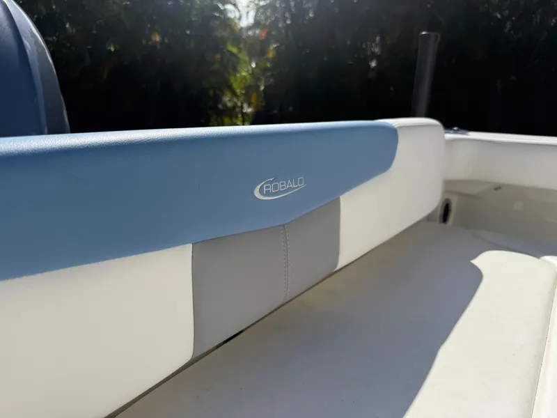 Slide: The Image of 2023 Robalo R222 boat interior with blue and white seating. - 20