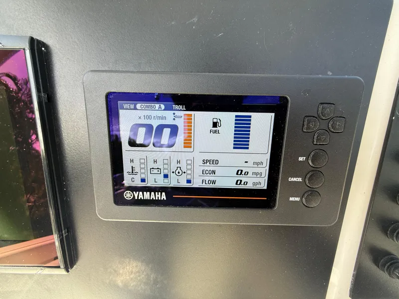 Slide: The Image of Yamaha display on 2023 Robalo R222 boat dashboard showing fuel and engine metrics. - 38
