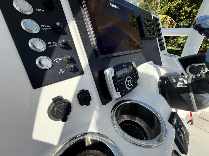 Slide: The Image of Control panel of 2023 Robalo R222 boat with navigation and accessory switches. - 43