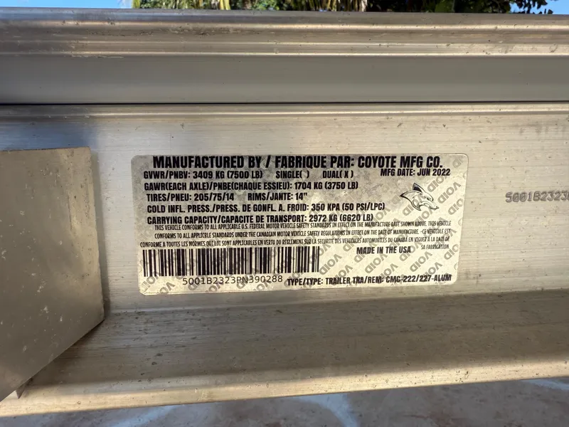 Slide: The Image of Label on a Robalo R222 trailer, manufactured by Coyote MFG Co., June 2022. - 59