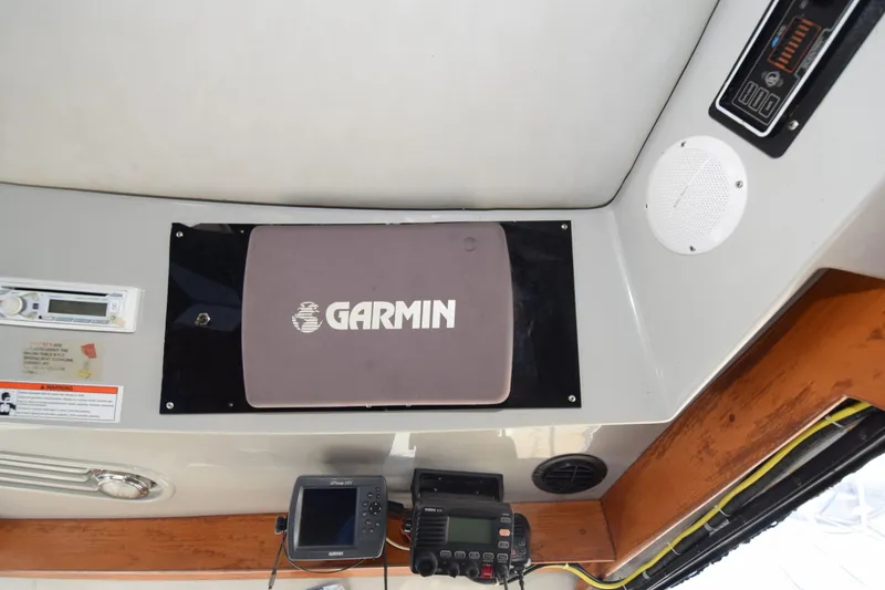 Slide: The Image of Garmin navigation equipment on 1988 Mediterranean 38 Convertible boat dashboard. - 8