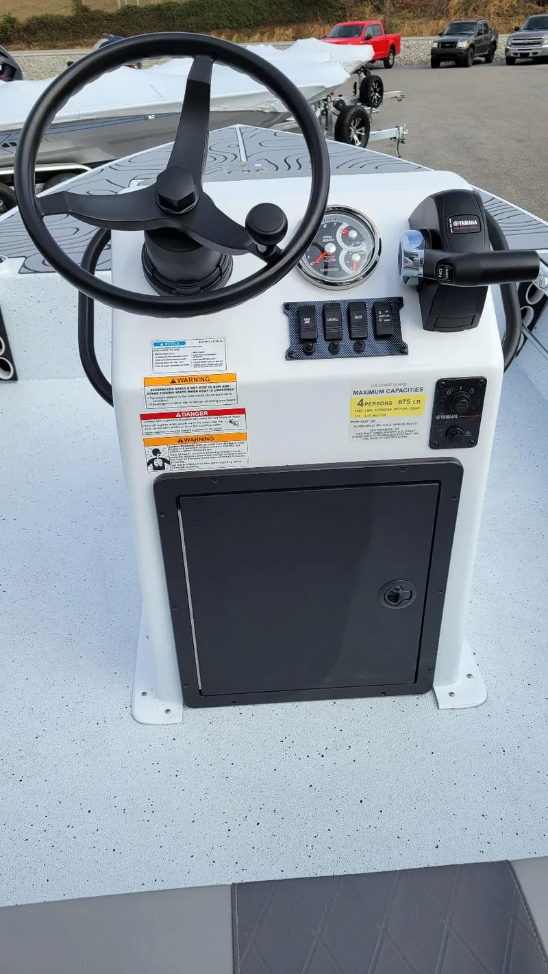 Slide: The Image of 2025 Xpress Skiff 185 console with Yamaha Vmax 115 SHO controls. - 11