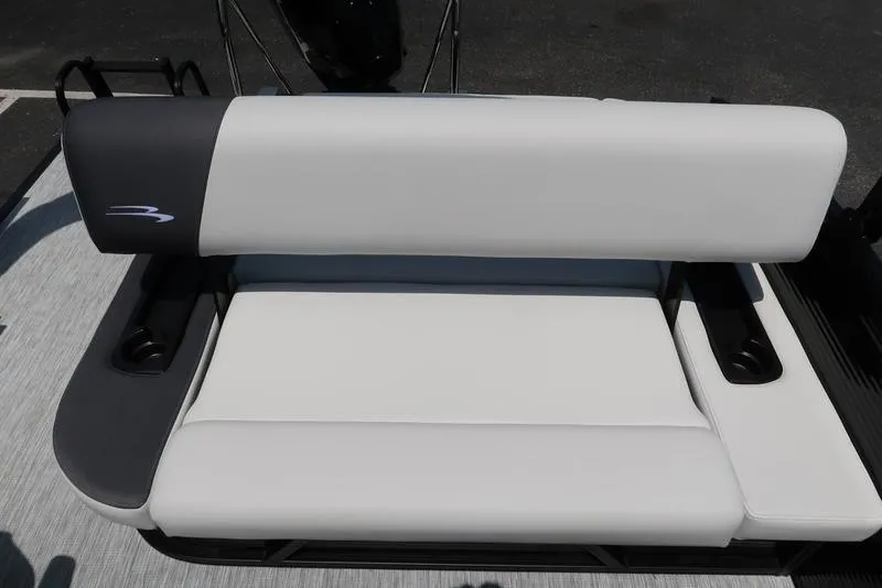 Slide: The Image of 2025 Bennington S Swingback 22 SSB boat seat, white and gray upholstery, sleek design. - 23