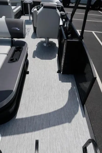 Slide: The Image of 2025 Bennington S Swingback 22 SSB pontoon boat interior with seating and flooring. - 24