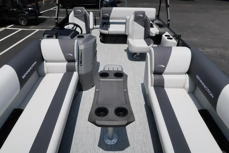 Slide: The Image of 2025 Bennington S Swingback 22 SSB pontoon boat interior with seating and table. - 6