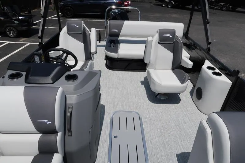 Slide: The Image of 2025 Bennington S Swingback 22 SSB pontoon boat interior with modern seating and helm. - 9
