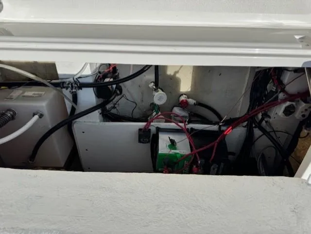 Slide: The Image of 2019 NauticStar 251 Hybrid boat wiring and battery compartment. - 11