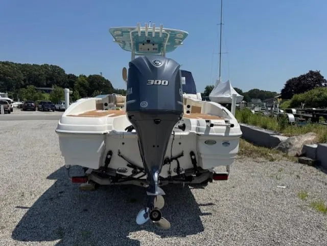 Slide: The Image of 2019 NauticStar 251 Hybrid boat with Yamaha 300 engine, parked on gravel. - 3