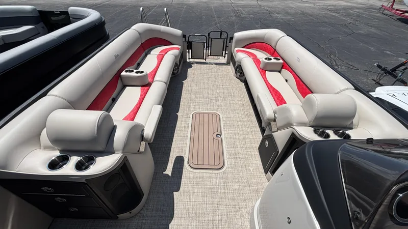 Slide: The Image of 2025 JC NEPTOON 27TT SPORT pontoon boat interior with red and beige seating. - 2