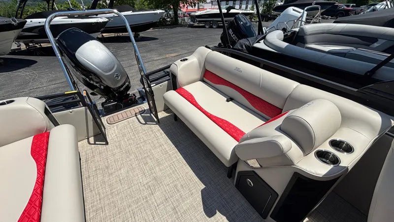 Slide: The Image of 2025 JC NEPTOON 27TT SPORT boat interior with red and beige seating, outboard motor. - 9