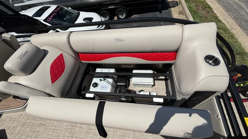 Slide: The Image of Luxurious seating on 2025 JC NEPTOON 27TT SPORT boat with storage compartment open. - 11