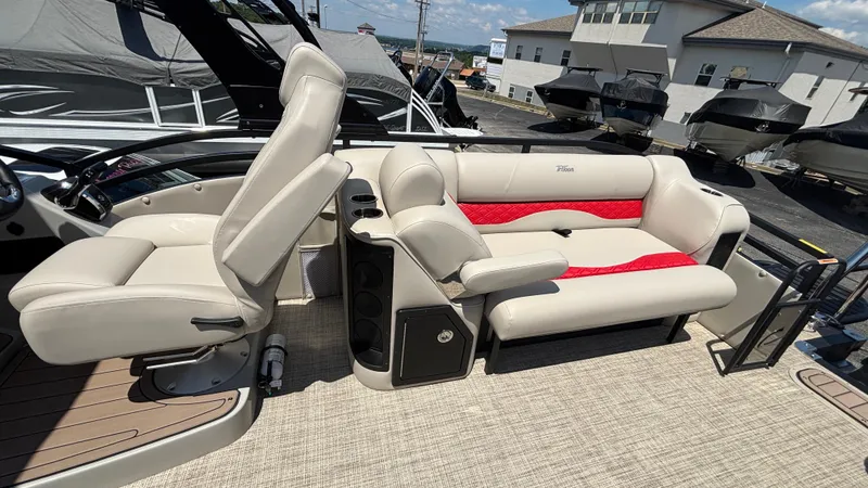 Slide: The Image of Luxurious seating on 2025 JC NEPTOON 27TT SPORT boat, featuring beige and red upholstery. - 12