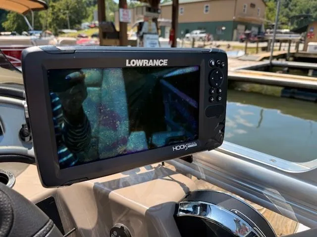 Slide: The Image of Lowrance fish finder on 2023 Sun Tracker Fishin' Barge 20 DLX boat dashboard. - 10