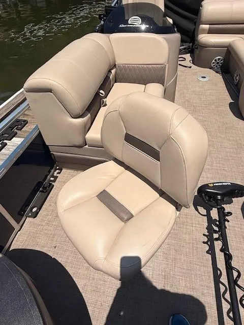 Slide: The Image of 2023 Sun Tracker Fishin' Barge 20 DLX with beige seating and trolling motor. - 12