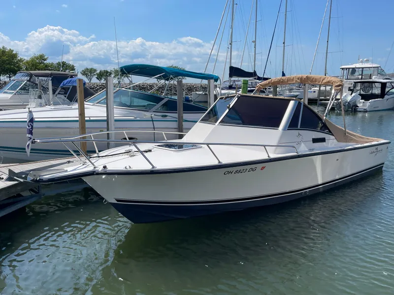 The Image of 1998 Albemarle 247 Cuddy Express boat named "Boomerang" docked in a marina. - 0