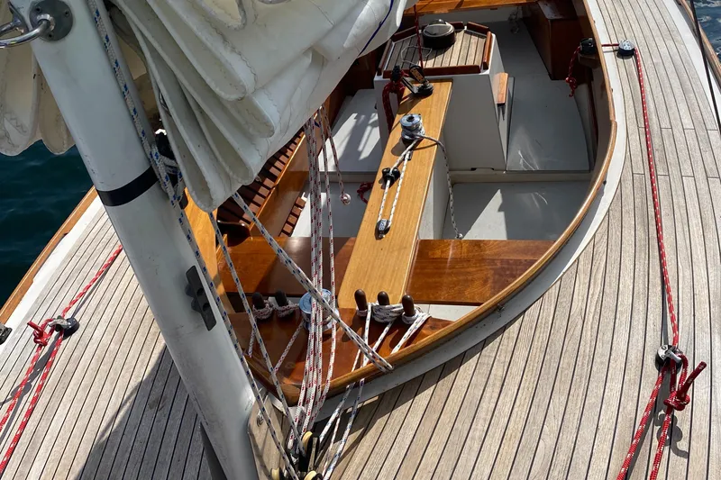Slide: The Image of Tofinou 7 sailboat deck, 1998 model, featuring wooden finish and rigging details. - 19