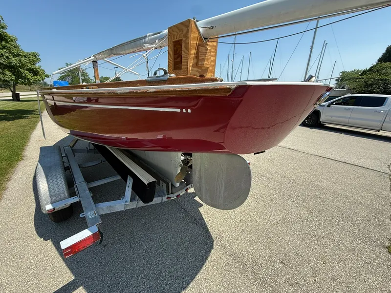 Slide: The Image of 1998 Tofinou 7 sailboat on trailer, red hull, parked outdoors. - 4