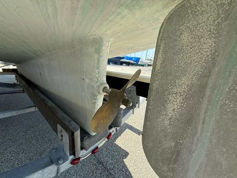 Slide: The Image of Tofinou 7 sailboat propeller and rudder detail, 1998 model on trailer. - 5
