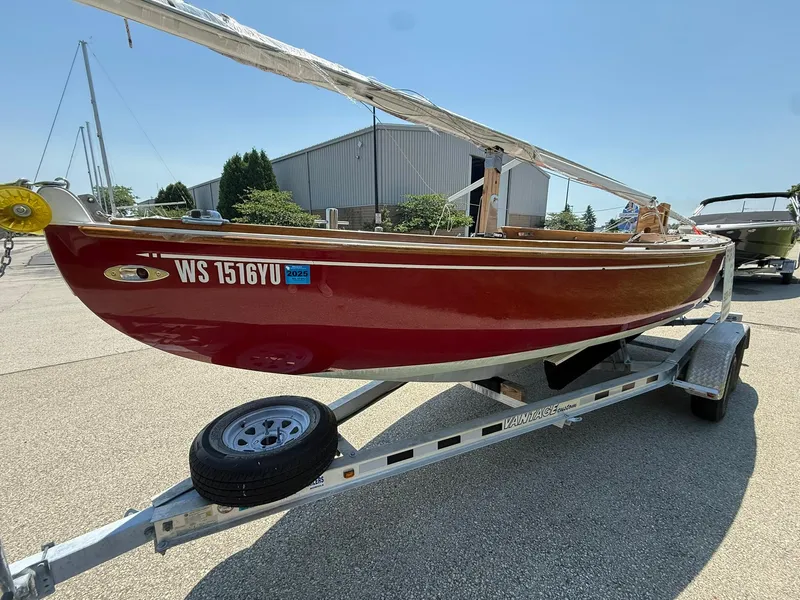 Slide: The Image of Red 1998 Tofinou 7 sailboat on trailer, parked outdoors under clear sky. - 7