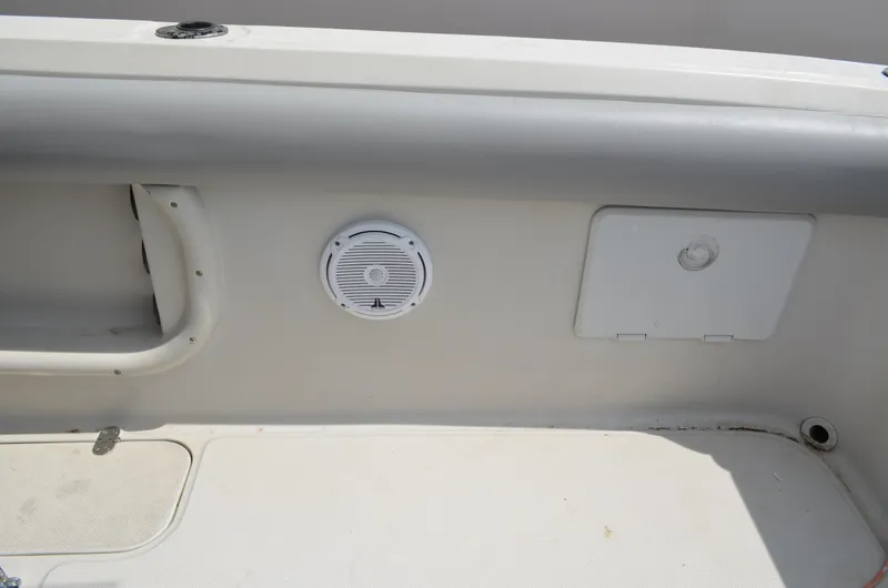 Slide: The Image of 2005 Glasstream 328 SCX boat interior with speaker and storage compartment. - 21