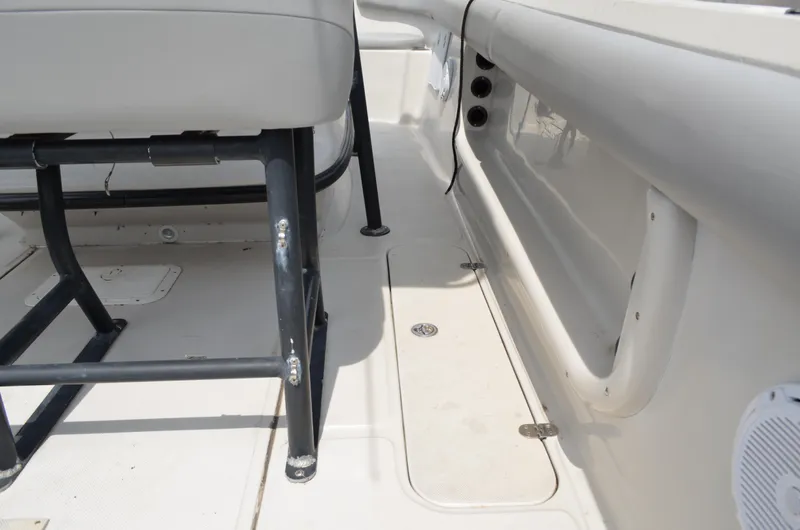 Slide: The Image of 2005 Glasstream 328 SCX boat interior, featuring seating and deck details. - 23
