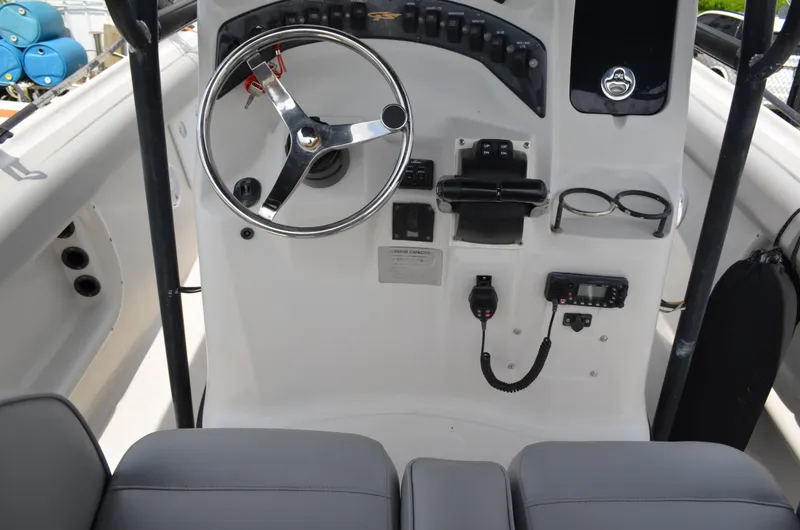 Slide: The Image of 2005 Glasstream 328 SCX boat helm with steering wheel and control panel. - 25