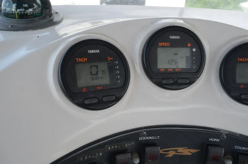 Slide: The Image of Dashboard of 2005 Glasstream 328 SCX with Yamaha gauges and compass. - 27